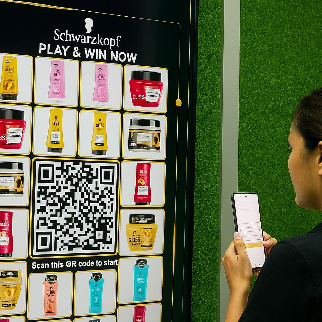 Guest playing Scan & Win interactive game by scanning QR code at a mall activation event in Dubai, with live name display and prize reveal on a big screen.
